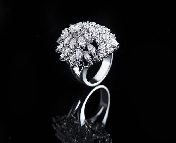 istock Diamond ring shot on a black reflective background 492148891