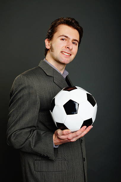 istock Man holds a soccer ball 492149465