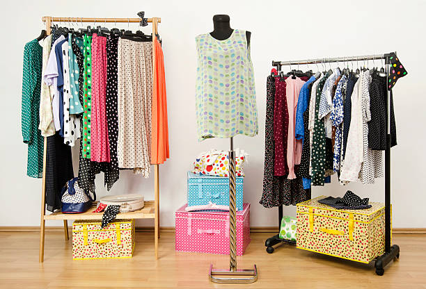 istock Dressing closet with polka dots clothes arranged on hangers. 492150089
