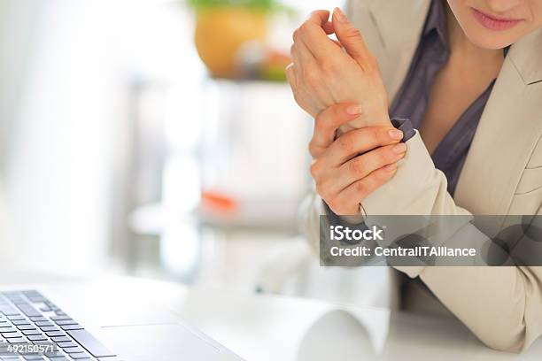 Closeup On Business Woman With Wrist Pain Stock Photo - Download Image Now - Pain, Wrist, Physical Injury