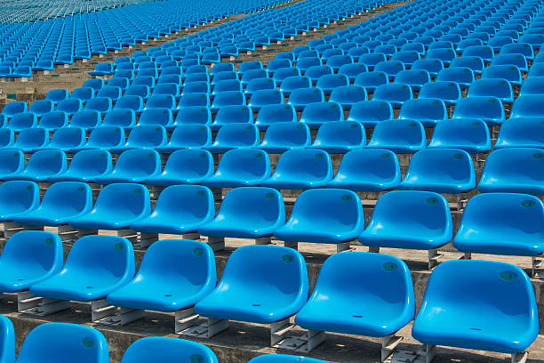 istock Field of empty blue plastic stadium seats. 492150873