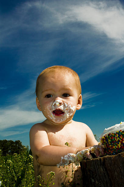 istock Surprise Baby with Cake on Face 492151161