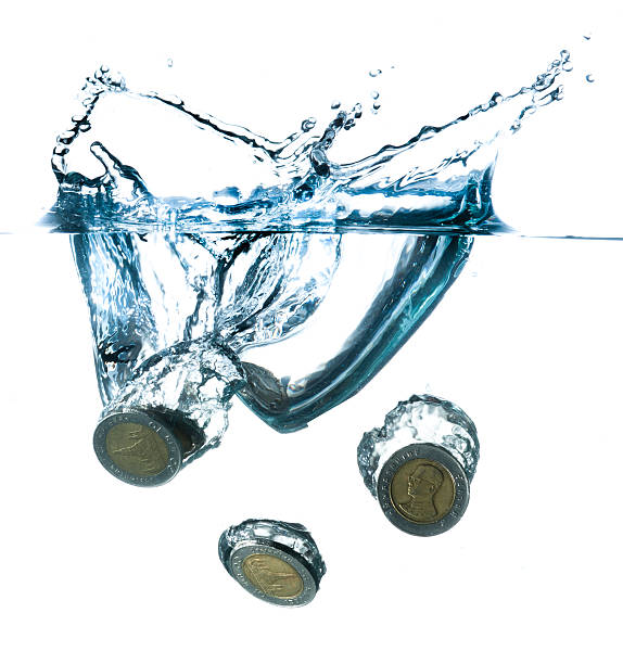 istock money in water with bubbles on white background 492151279