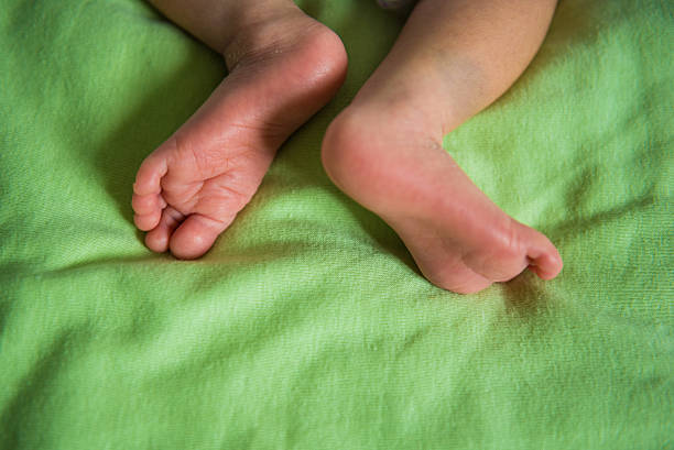 istock newborn baby feet 492151484