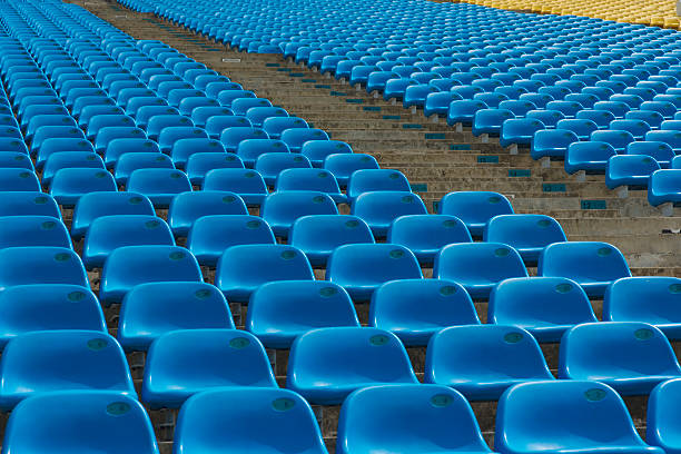istock Field of empty blue plastic stadium seats. 492152025