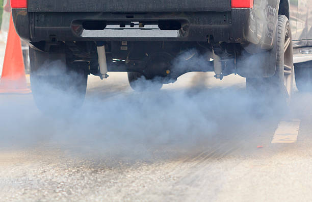 istock Air pollution from vehicle exhaust pipe on road 492154262