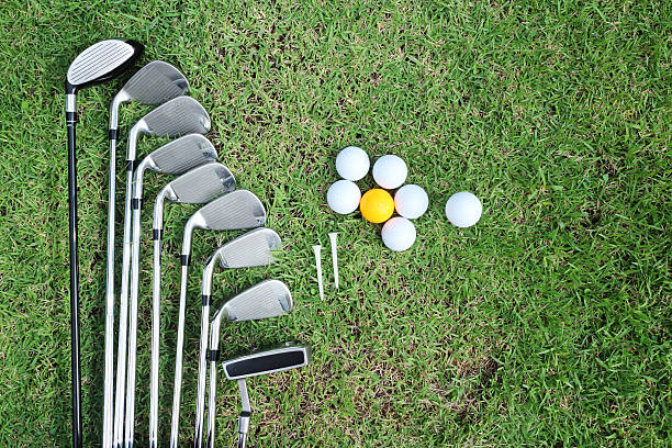 istock Golf ball and golf club in bag on green grass 492155126