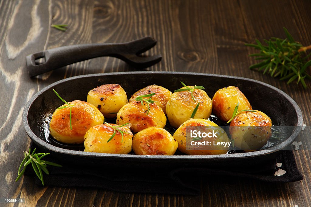 Baked potatoes with rosemary. 2015 Stock Photo