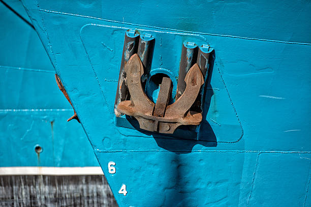 istock Rusted rugged Anchor on blue fishing ship 492156006