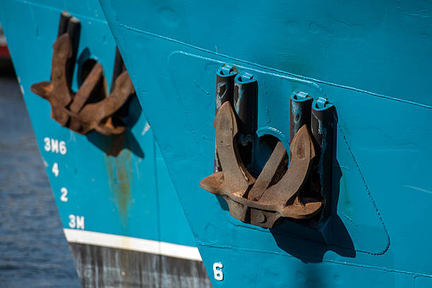 istock Rusted rugged Anchor on blue fishing ship 492156016