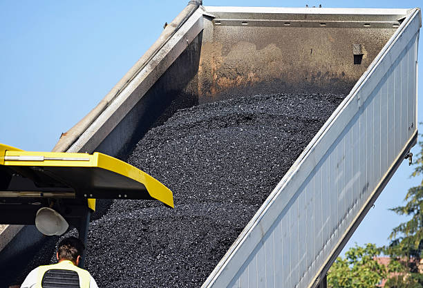 istock Truck delivers new asphalt material 492156686