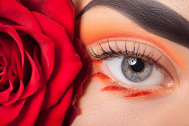 istock Beautiful eye make-up and flowers. 492157110