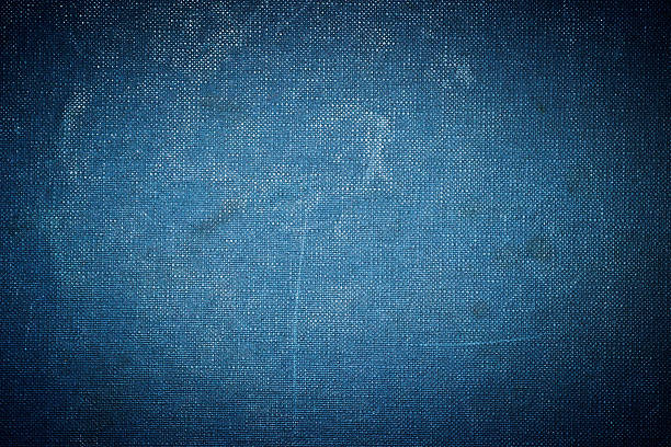 Grunge vignetted textile background - dark blue colored Grunge vignetted textile background - dark blue colored textured arts and entertainment on gunny stock pictures, royalty-free photos & images