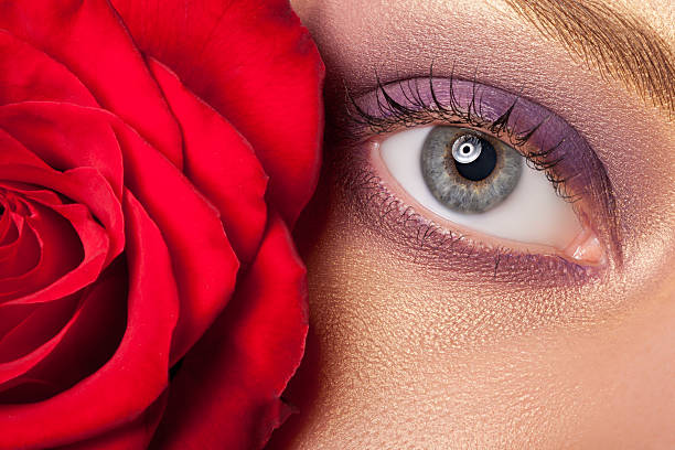 istock Beautiful eye make-up and flowers. 492157386