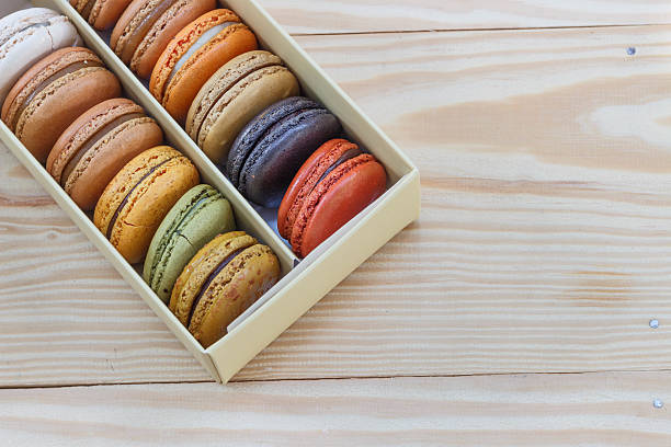 French colorful macarons on wood table
