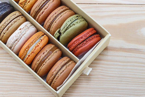 French colorful macarons on wood table
