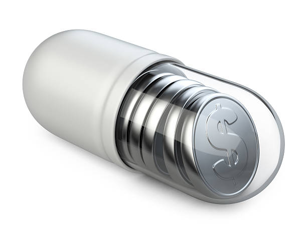 istock Medical transparent capsule with a silver coins. 492159004