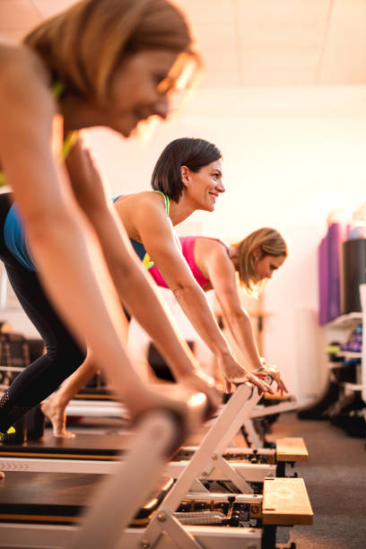 istock Group of happy women exercising on Pilates training class. 492159664