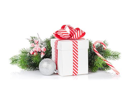 Christmas gift box, bauble and candy cane. Isolated on white background
