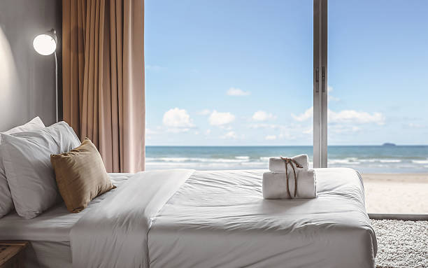 seaview bedroom relaxation in bedroom with seaview hotel suite photos stock pictures, royalty-free photos & images