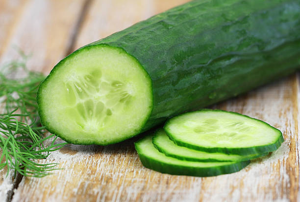 istock Cucumber and fresh dill on rustic wood, closeup 492189564