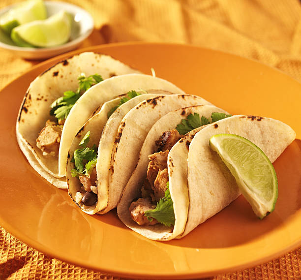 soft corn tacos with chicken and cilantro