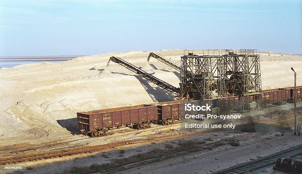 Warehouse salt (NaCl) near Lake Baskunchak . Astrakhan, Russia - September 17, 1997 : Warehouse salt (NaCl) in the open air , not far from Lake Baskunchak . Agricultural Machinery Stock Photo