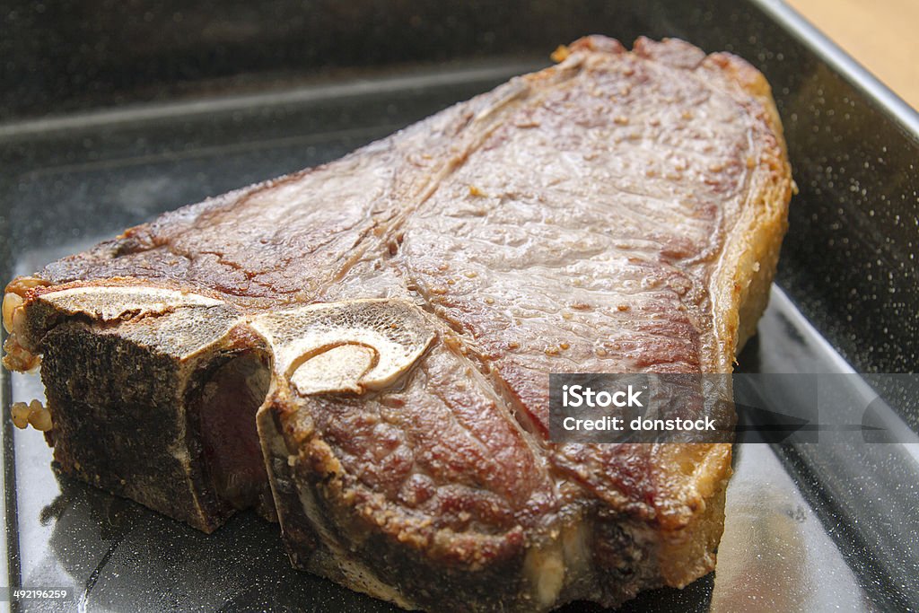 t-bone steak t-bone steak in a pan Aberdeen Angus Cattle Stock Photo