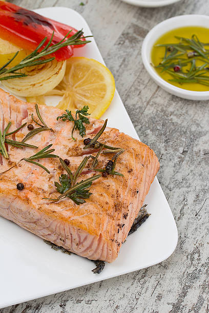 istock Delicious portion of fresh salmon fillet with aromatic herbs 492196290