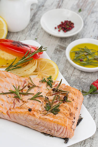 istock Delicious portion of fresh salmon fillet with aromatic herbs 492196528