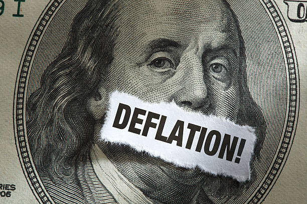 istock One Hundred Dollar Bill with word Deflation Over it 492197591