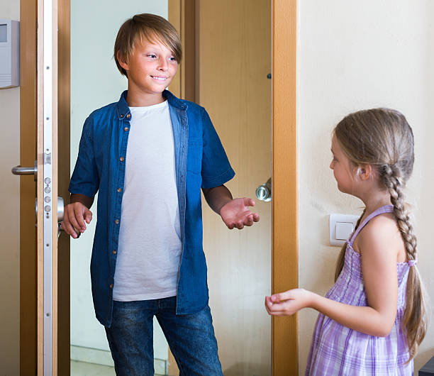 istock child receiving expected friend at home interior 492197886