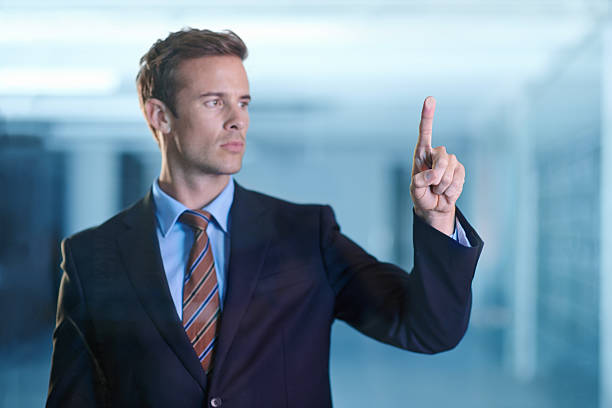 Cropped shot of a handsome young business professional using a digital interfacehttp://195.154.178.81/DATA/i_collage/pi/shoots/783308.jpg