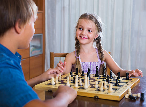 istock children at chess board indoors 492197918