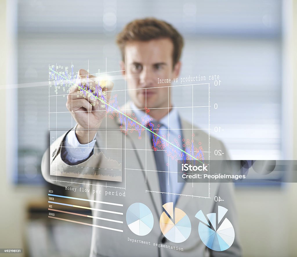 Future business trends Cropped shot of a handsome young businessman using a digital interface 20-29 Years Stock Photo