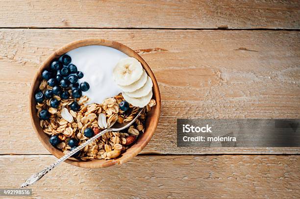 Homemade Oatmeal Granola With Peanuts Blueberry And Banana Stock Photo - Download Image Now