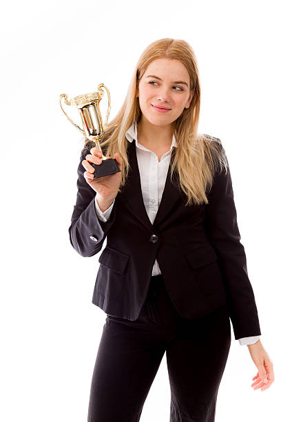 istock Businesswoman holding a golden trophy 492198875