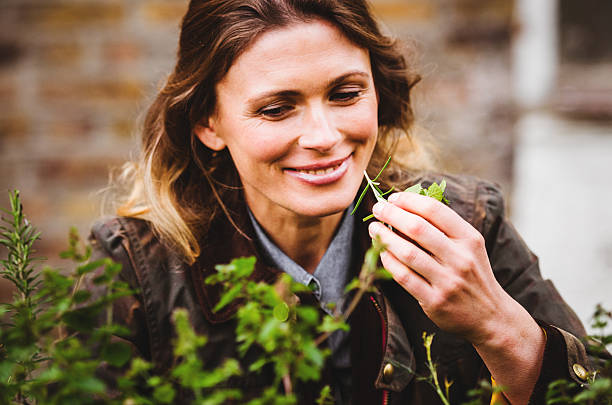 istock gardening woman smell the mint 492199673