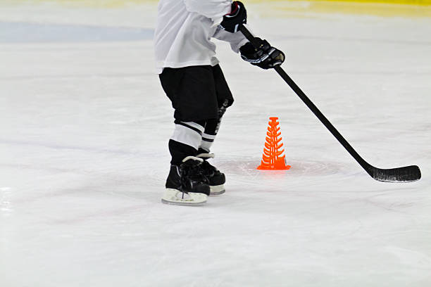 Child at ice hockey practice stock photo