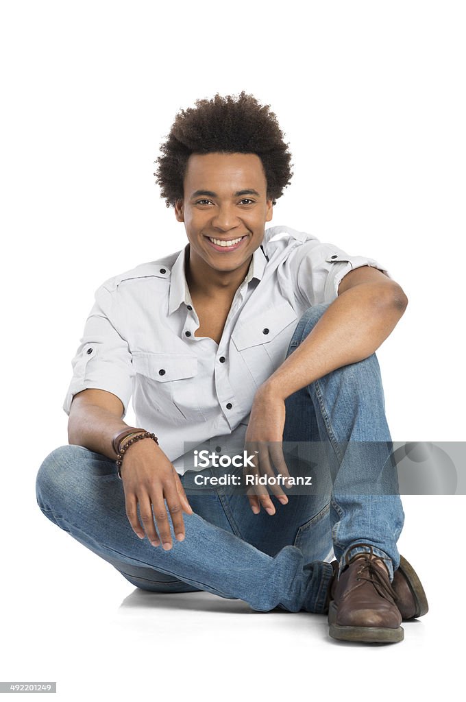 Smiling African Man Sitting Portrait Of Happy Young African Man Sitting Isolated On White Background Men Stock Photo