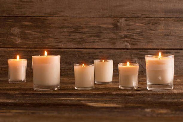 istock scented candles on old wooden background 492220846