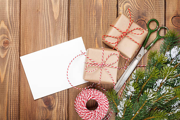 istock Christmas presents wrapping and snow fir tree 492223362