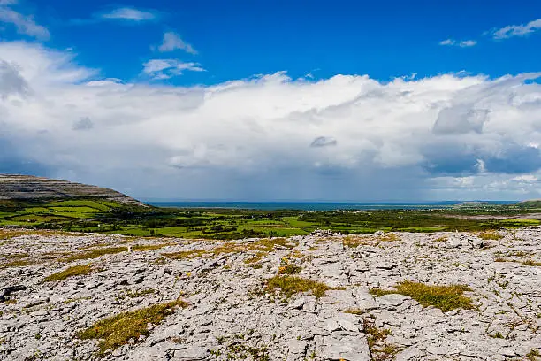 Burren region, Clare, Ireland - August 23, 2010: The Burren measures 250 square kilometres and is enclosed roughly within the circle made by the villages of Ballyvaughan, Kilfenora and Lisdoonvarna.