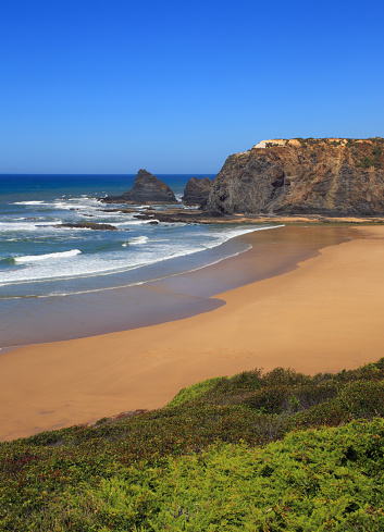 Portugal, Algarve Region, Odeceixe, South-West Alentejo and Vicentine Coast Natural Park cliff top view of Odeceixe beach and estuary of the River Mira, which forms the border between the Algarve and Alentejo here.