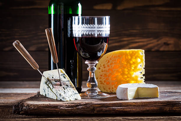 istock Fresh wine in glass with cheese and grapes 492225926