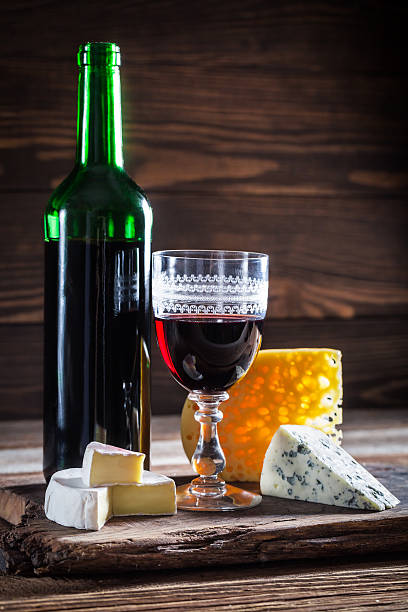 istock Fresh wine in glass with various cheese 492227736