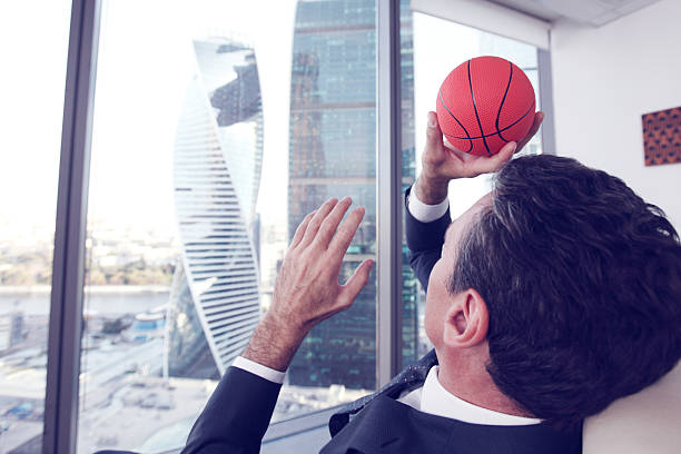 istock Businessman with basketball 492229396
