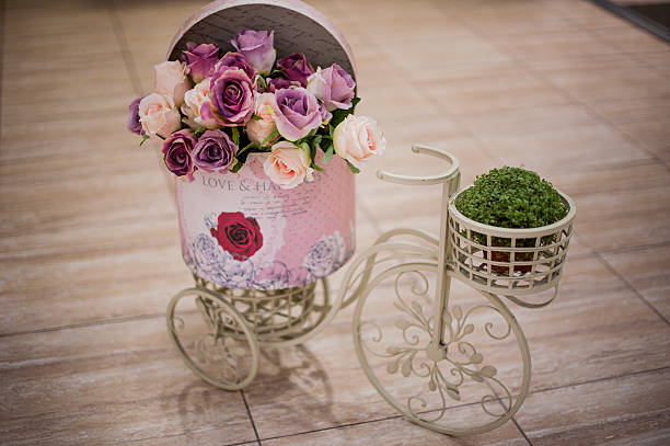 Rose flower in the basket on bicycle