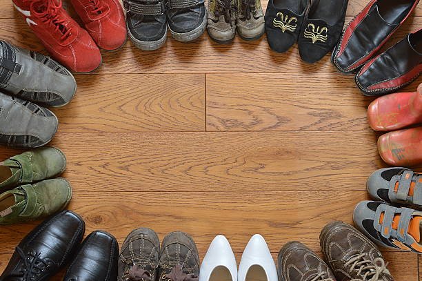 istock pairs of different shoes standing in a circle 492232926