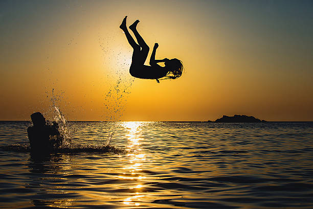 istock Friends having fun in water 492250718